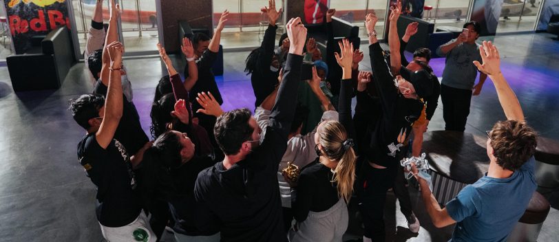 Corporate group event guests celebrating together at a K1 Speed Canada venue