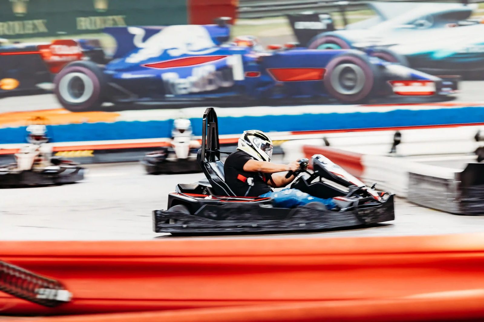 Indoor go-kart racing at a K1 Speed Canada entertainment venue